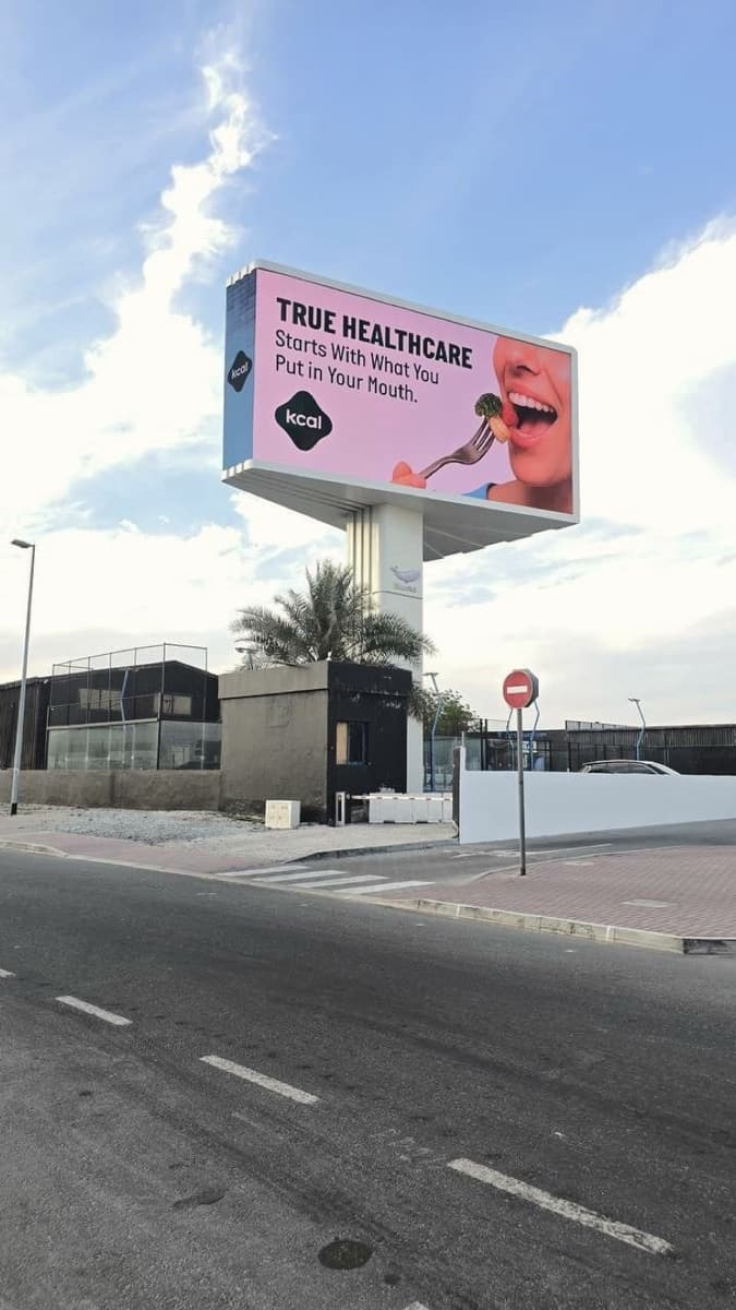 Kcal campaign on a WideLoop screen in Dubai, photographed by day