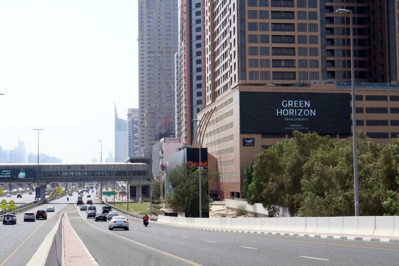 Green Horizon Developments campaign on a WideLoop screen in Dubai, photographed by day