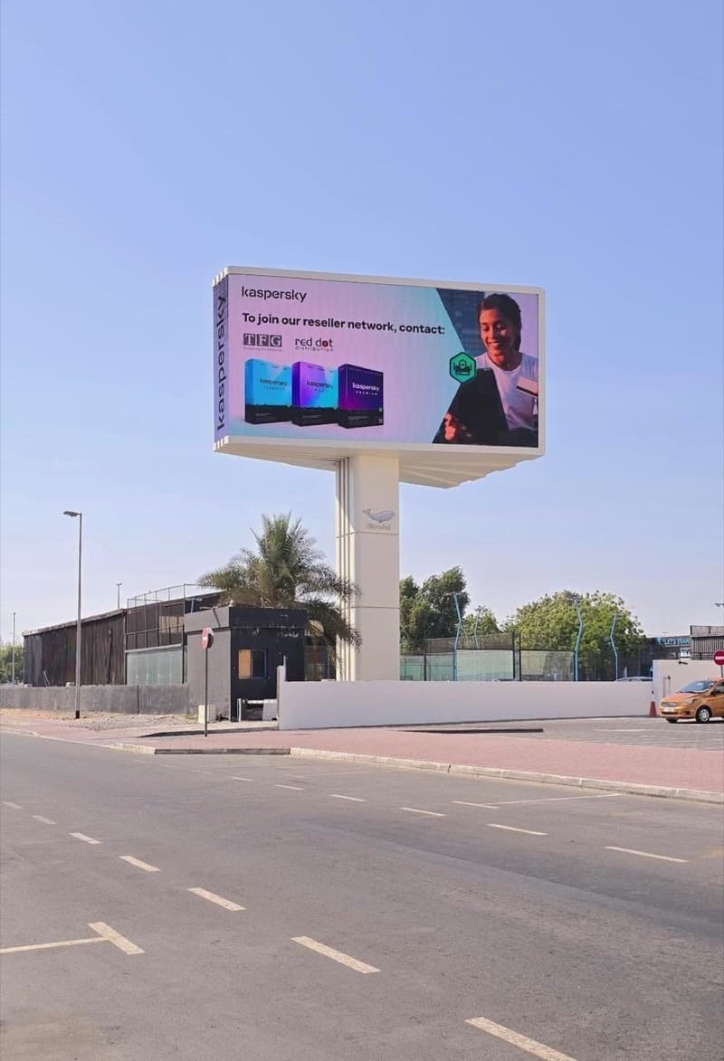 Kaspersky campaign on a WideLoop screen by a Dubai road, photographed by day