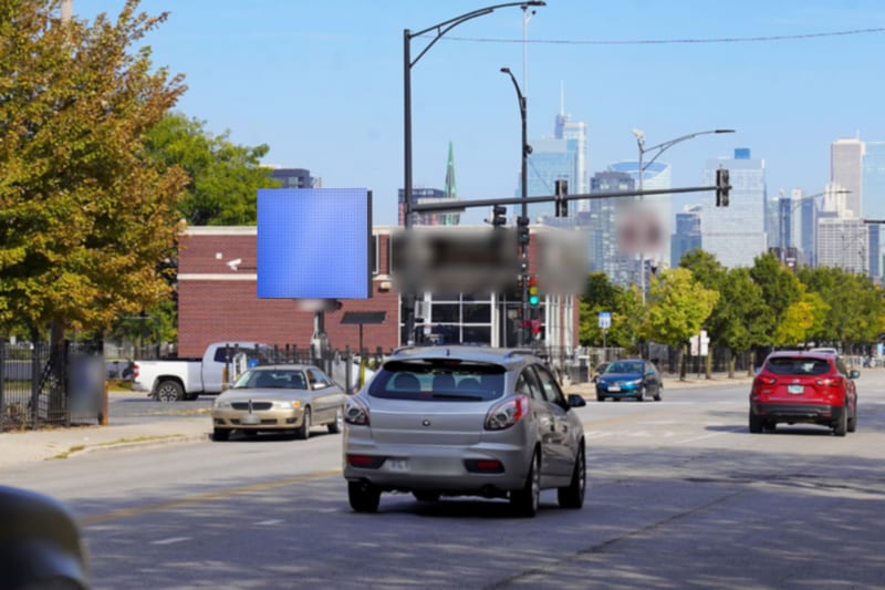 Compact digital screen at Damen Ave at Madison St · United Center, photographed by day; the advertiser's content is replaced with a preview of your brand