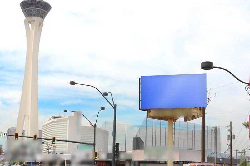 Digital poster at Las Vegas Blvd at Wyoming Ave · north of the STRAT, photographed by day; the advertiser's content is replaced with a preview of your brand
