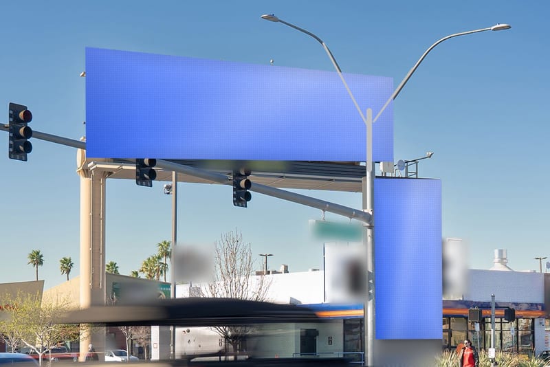 Digital bulletin at Paradise Rd at Harmon Ave · east of the Strip · vertical face, photographed by day; the advertiser's content is replaced with a preview of your brand