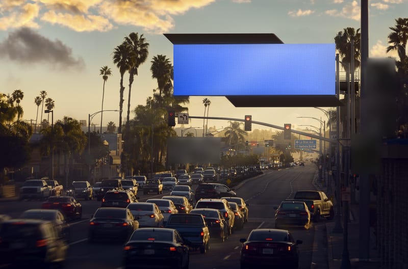 Digital spectacular at W Century Blvd near La Brea Ave · stadium district, photographed at dusk; the advertiser's content is replaced with a preview of your brand
