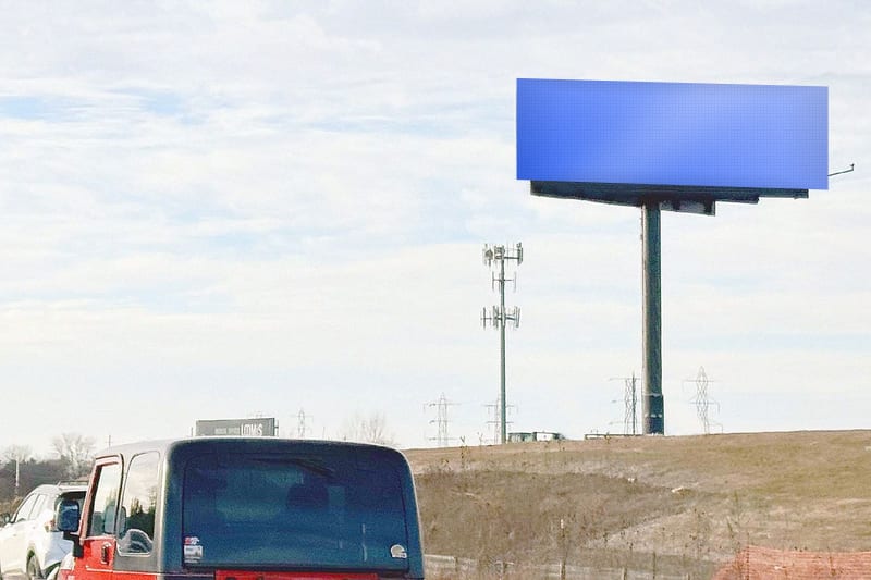 Digital bulletin at I-43/894 between Loomis Rd and 35th St · Greenfield, photographed by day; the advertiser's content is replaced with a preview of your brand